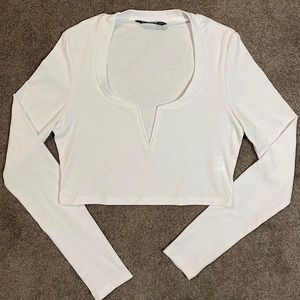 cropped white long sleeve top